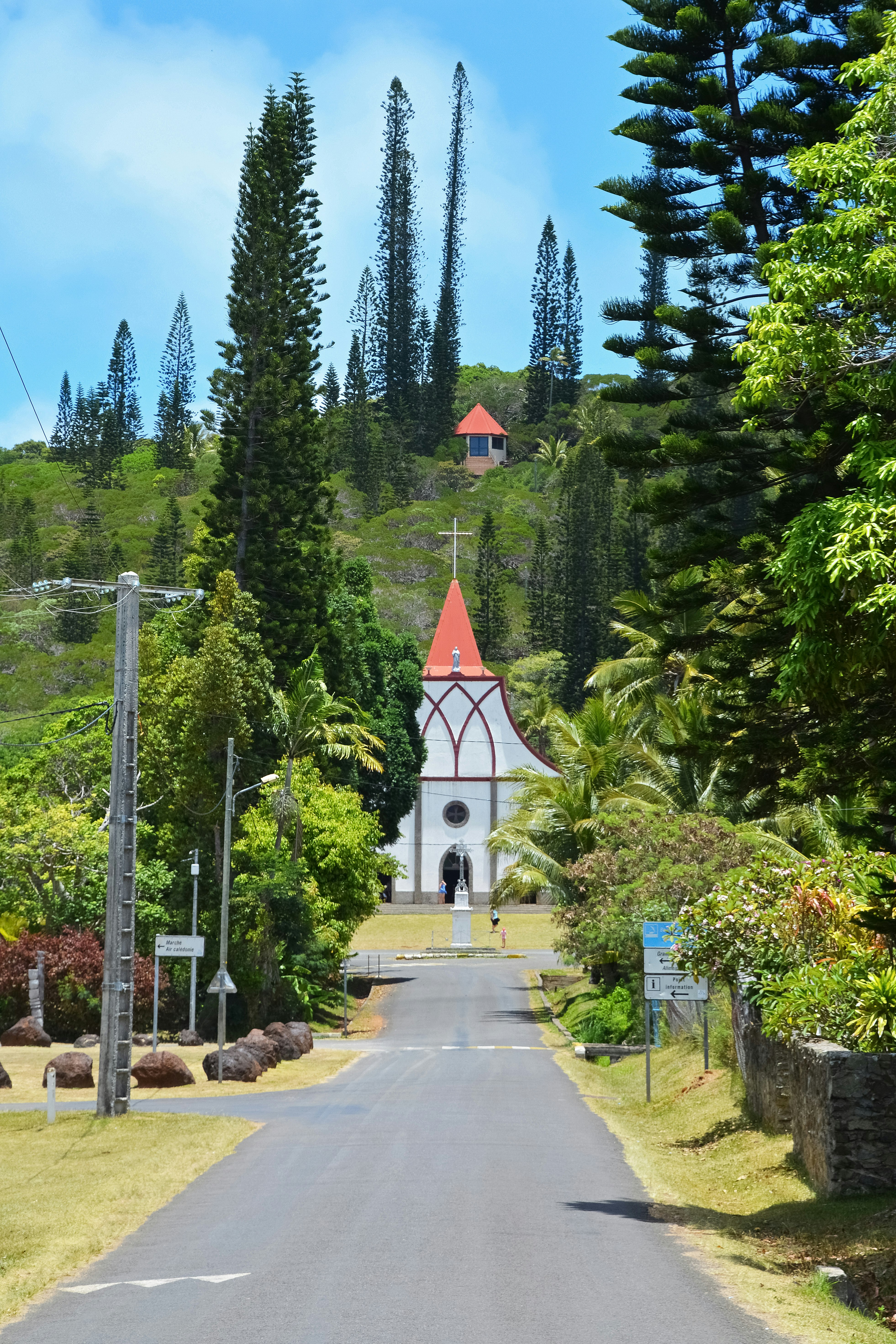 white and green cathedral surrounded by green trees during daytime